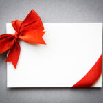 Card with red ribbons bows